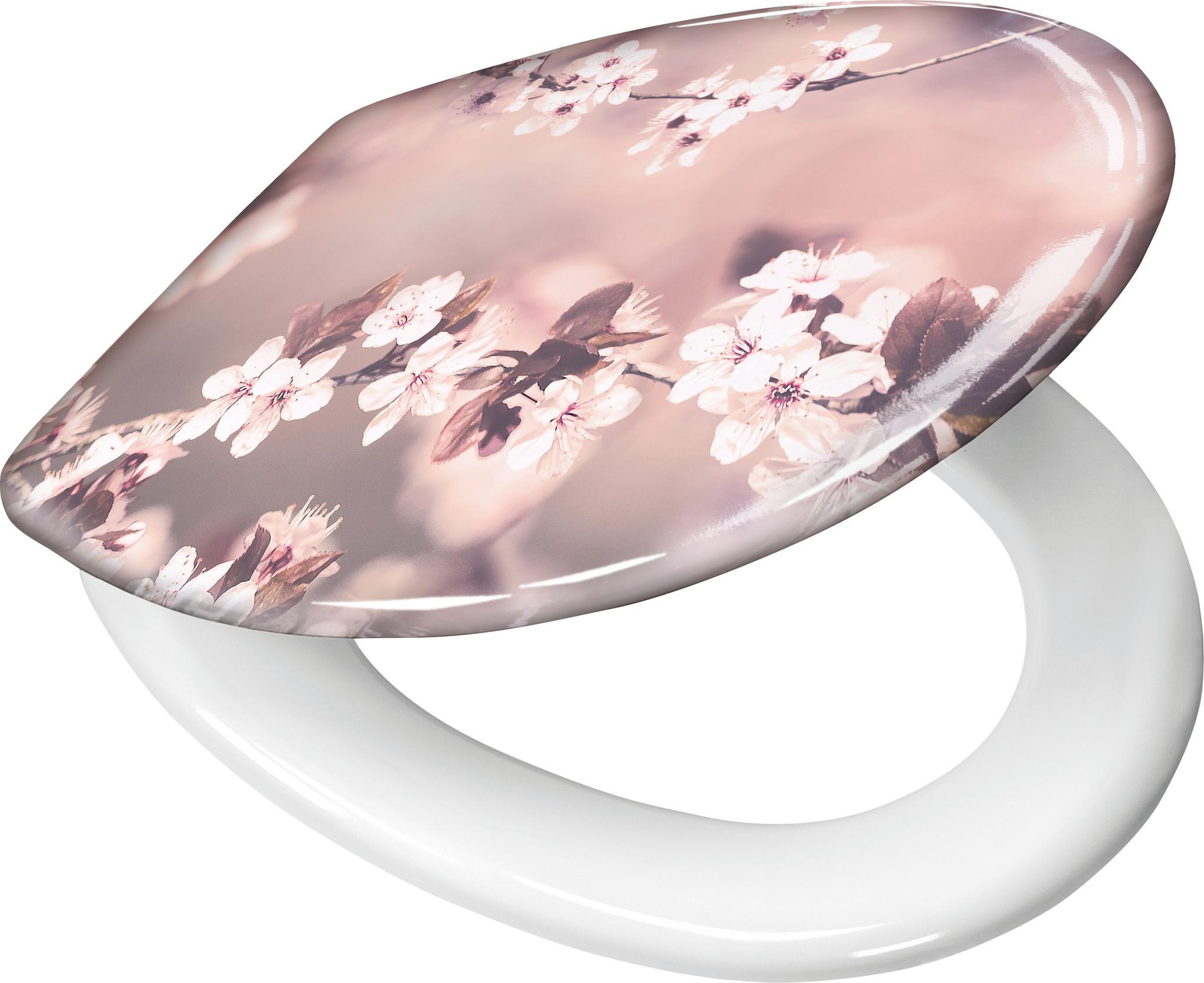 Toilettensitz mit weißer Brille und rosa Kirschblütenmotiv auf Deckel