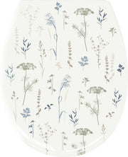 WC-Sitz mit zarten Wiesenblumen in Beige, Blau und Grün dekoriert