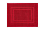 Roter Frottiervorleger PLAZA in 60 x 80 cm liegt aufgefaltet in rechteckiger Form.