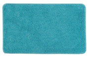 Badteppich RELAX in Türkis im Format 60 x 100 cm liegt flach auf dem Boden.