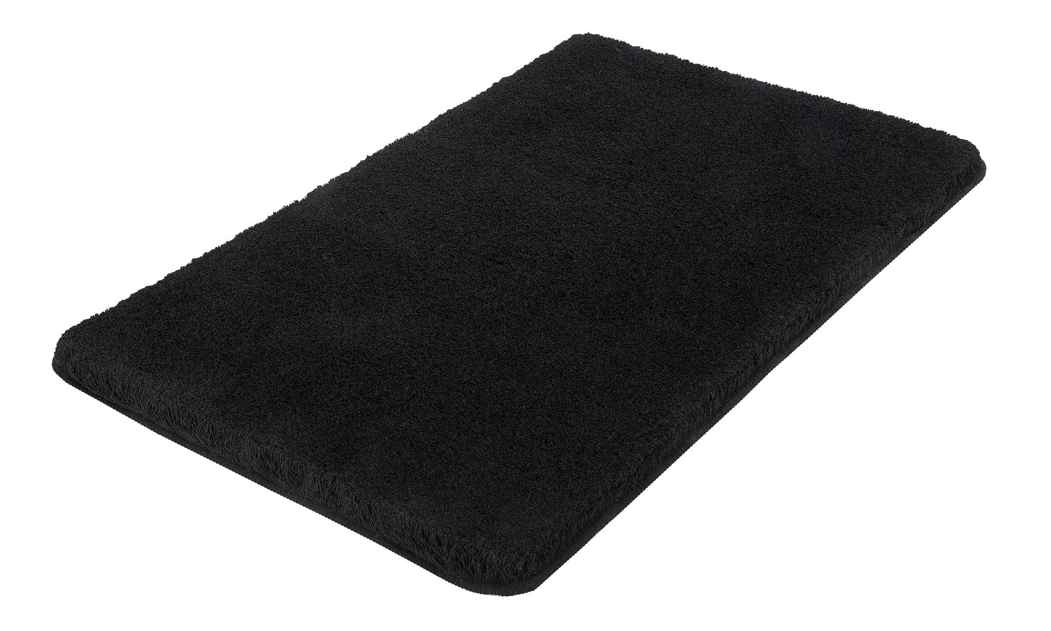 Rechteckige schwarze Badematte mit weicher Oberfläche von oben gesehen