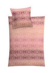 Rosa Bettwäsche-Set mit Kissen und Decke im verlaufenden Rautenmuster