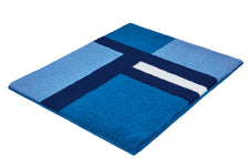 Blauer Hochflor-Badteppich mit geometrischem Streifenmuster.