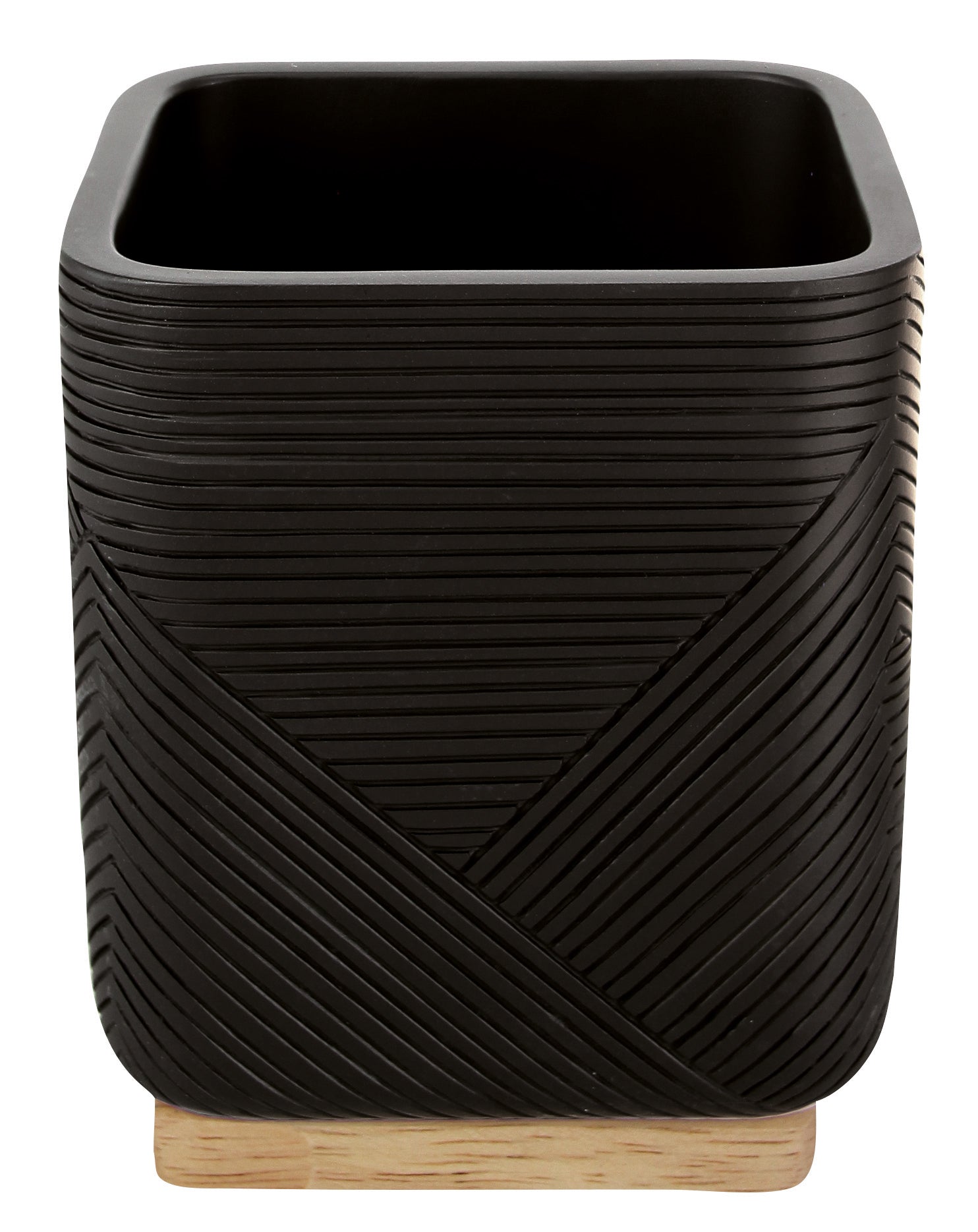 Zahnputzbecher CROSSOVER Schwarz steht auf einem hellen Holzsockel.