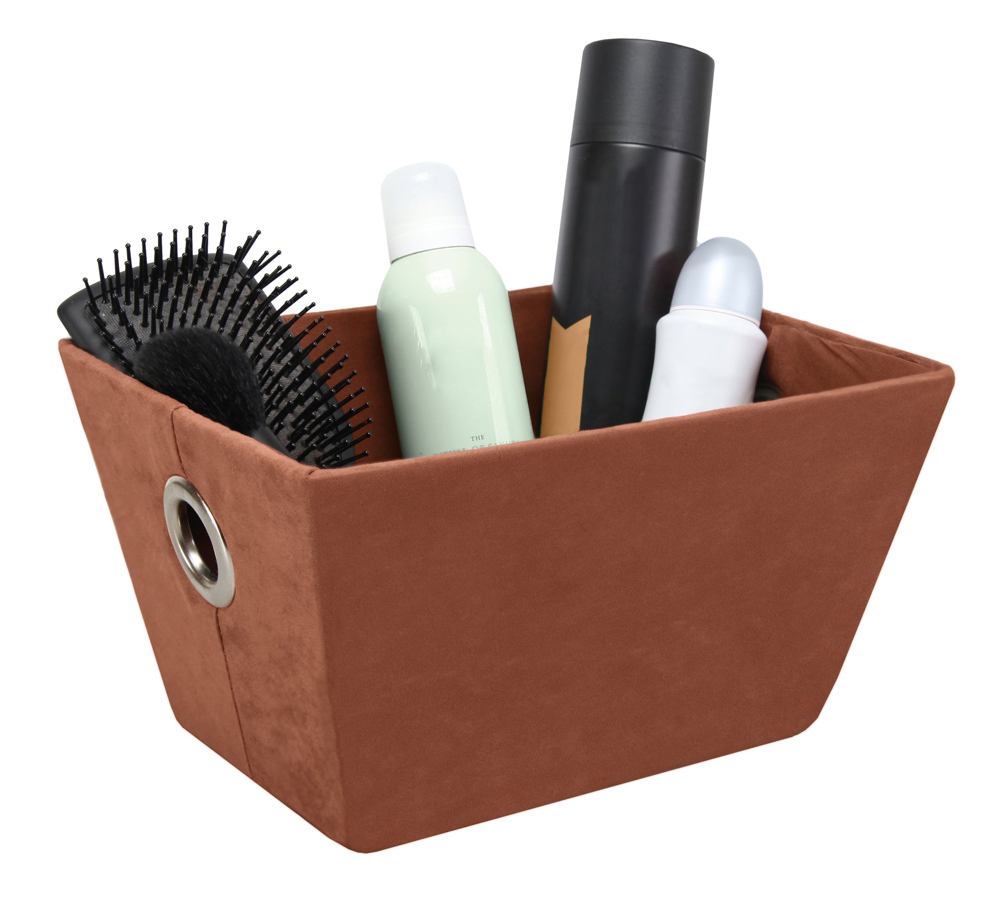 Aufbewahrungskorb SUEDE Brasil M ist mit Haarbürste und Pflegeprodukten gefüllt.