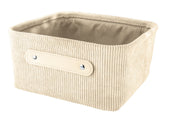 Aufbewahrungskorb BEDFORD Beige M aus Cordstoff steht leer mit sichtbarem Griff nach vorn gerichtet.
