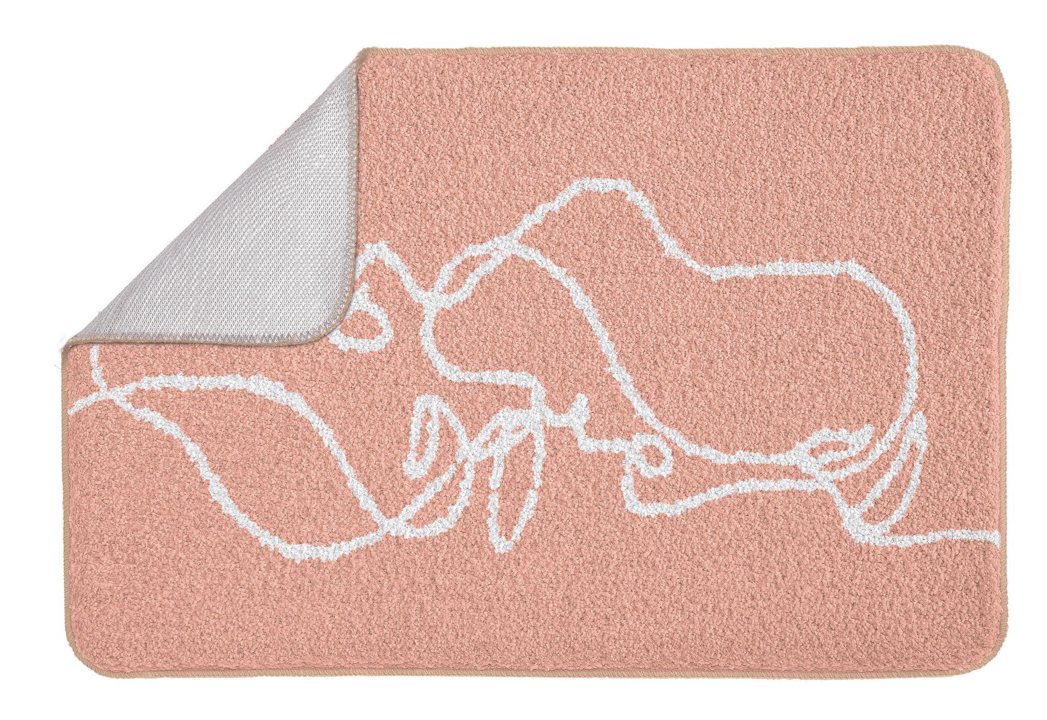 Rosafarbene Badematte mit weißem Linienmuster, Ecke oben aufgeklappt