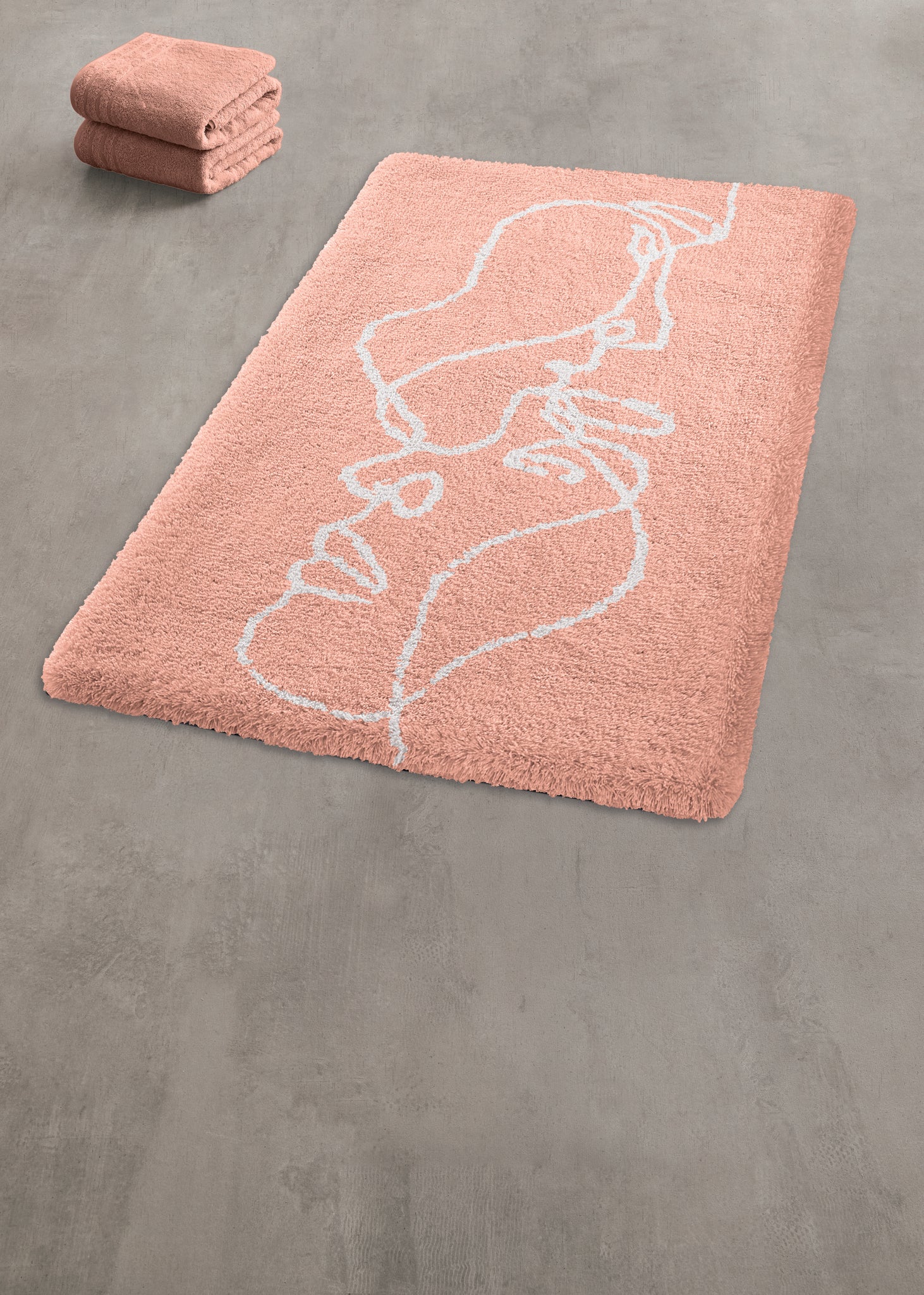 Rosa Badezimmerteppich mit weißem Liniengesicht auf Betonboden