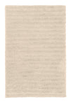 Rechteckiger, hochfloriger Badteppich in hellem Beige von oben gesehen
