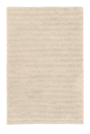 Rechteckiger, hochfloriger Badteppich in hellem Beige von oben gesehen
