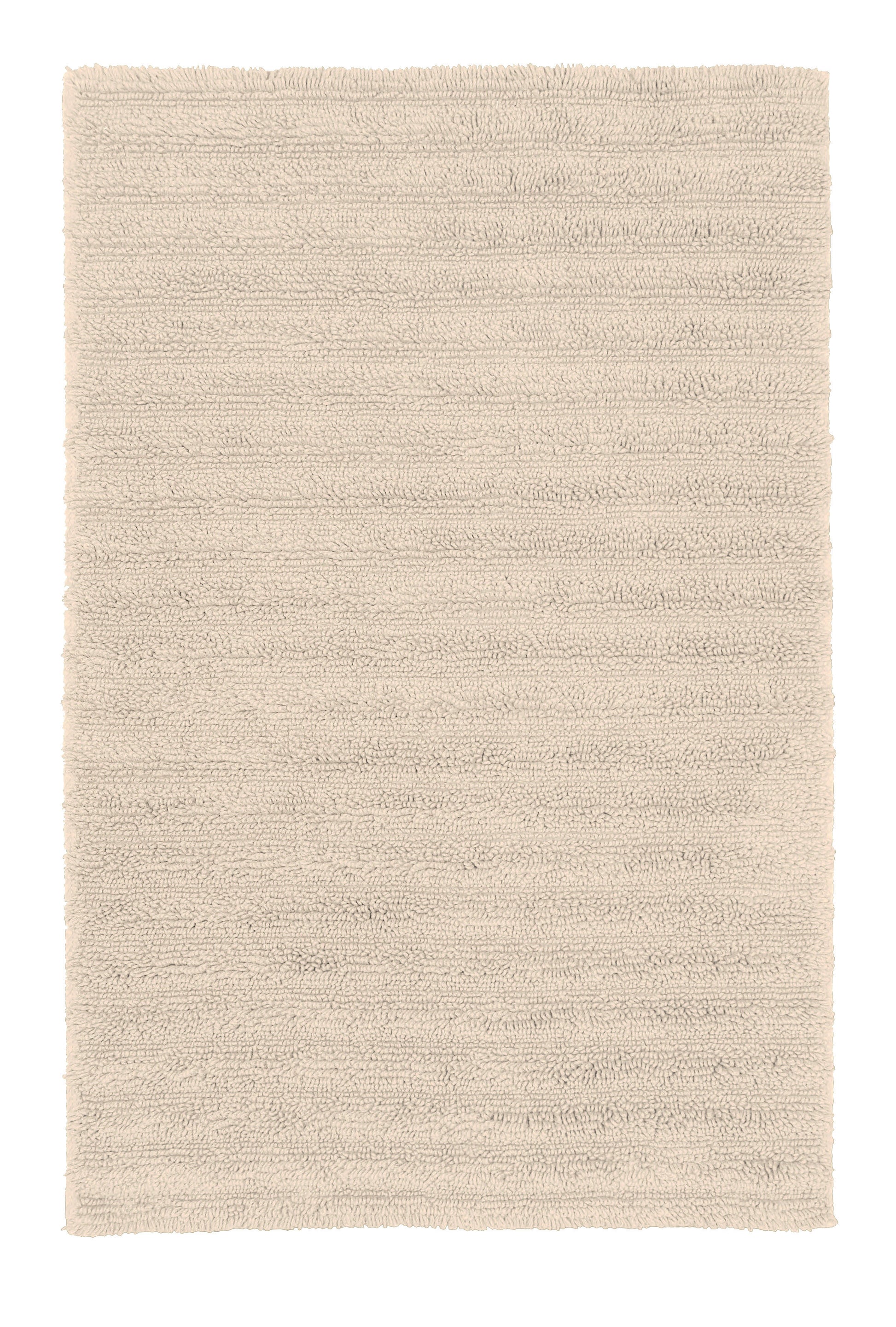 Rechteckiger, hochfloriger Badteppich in hellem Beige von oben gesehen