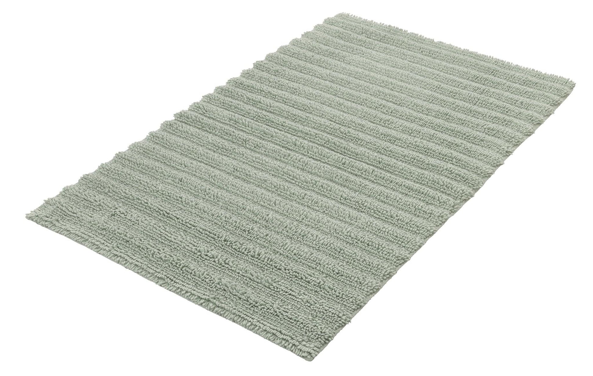 Badteppich YARA Maledivia 70 x 120 cm liegt in zartgrüner Farbe auf dem Boden.