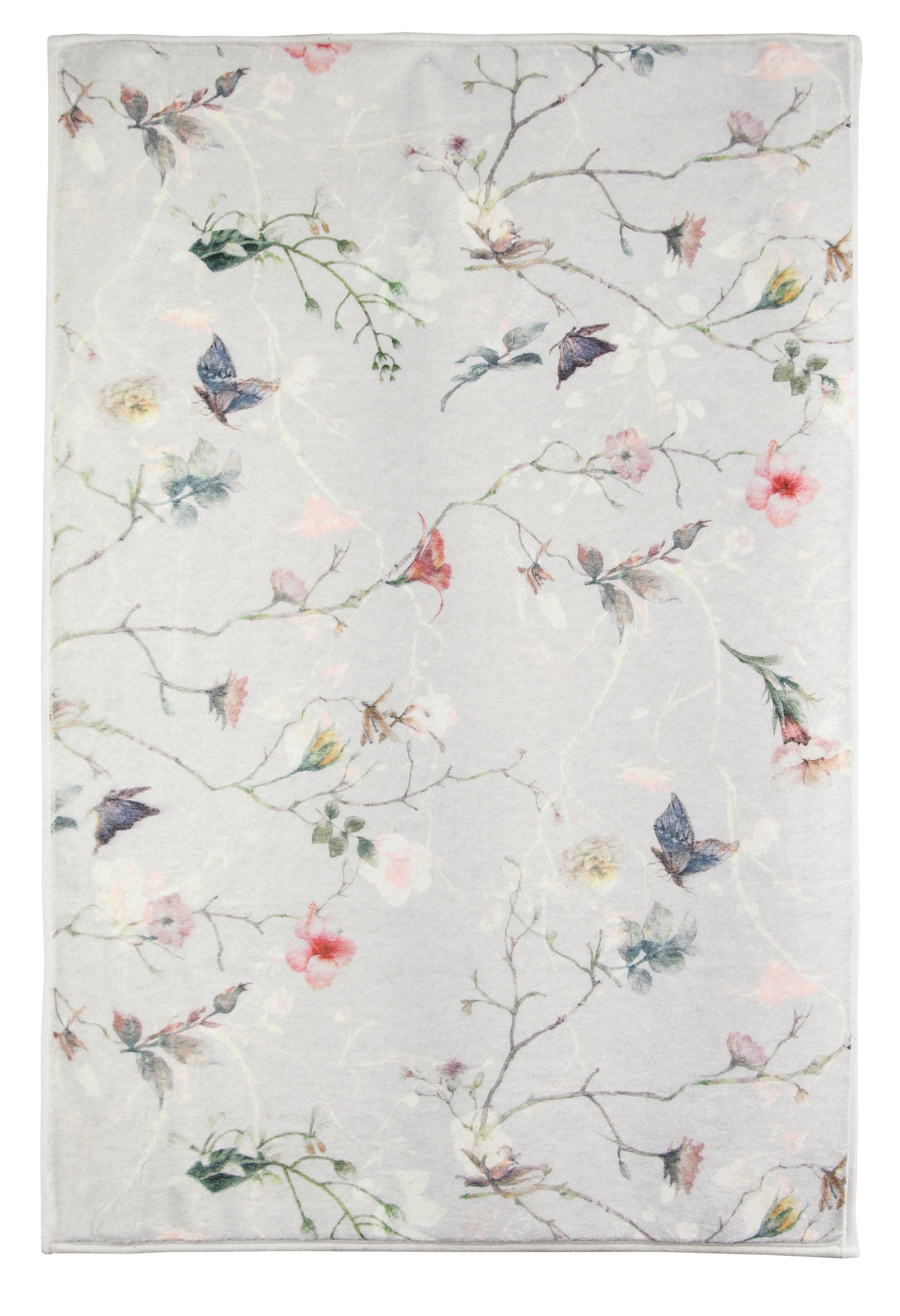 Badteppich FLORES Multicolor 60 x 90 cm mit zartem Blumenmuster auf hellem Hintergrund ist abgebildet.