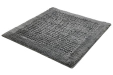 Graue rechteckige Badematte mit dichtem, flauschigem Flor und Struktur