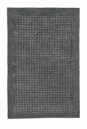 Graue rechteckige Badematte mit weicher Struktur und breitem Rand