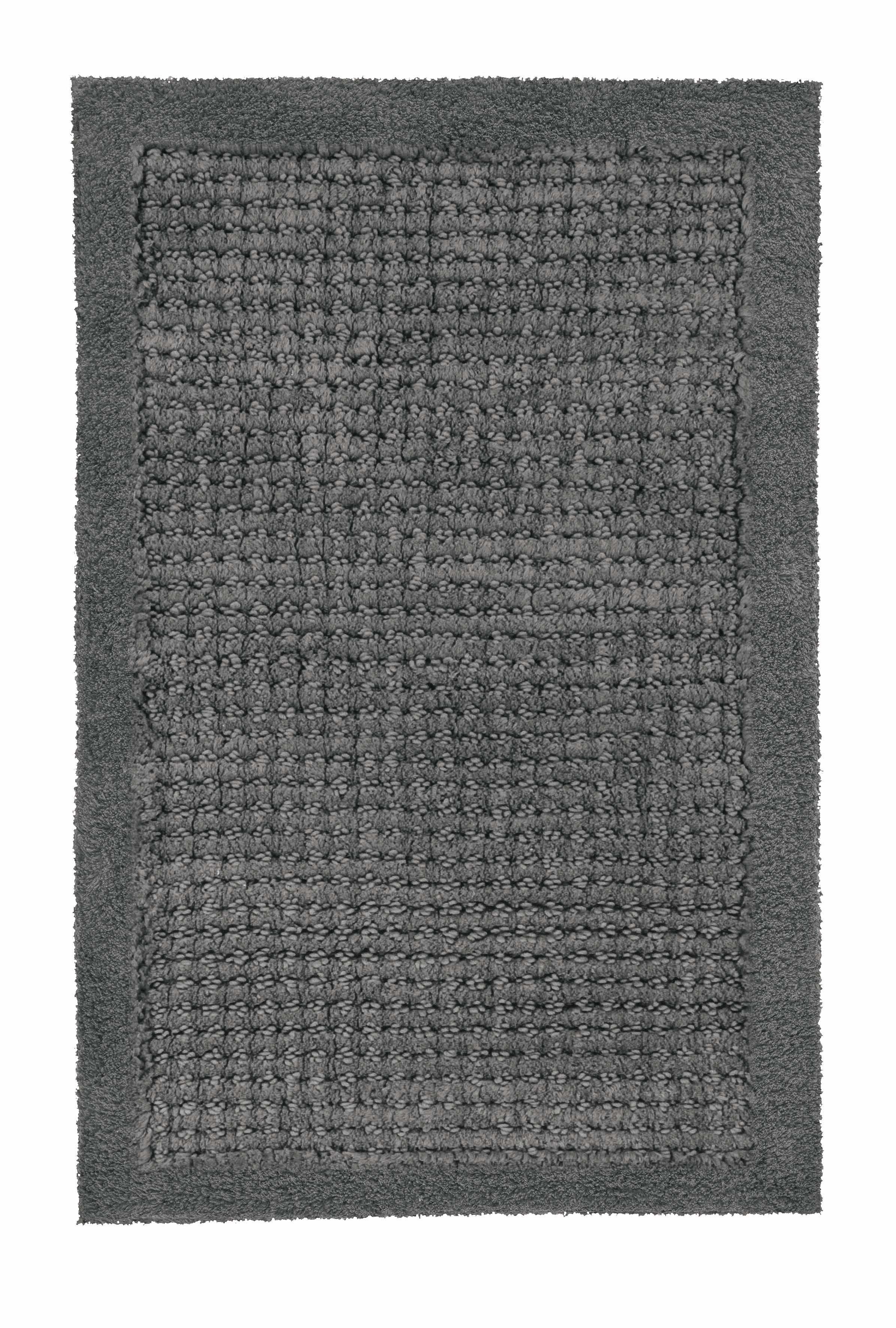 Badteppich NET Schiefer 60 x 90 cm liegt rechteckig mit Strukturflor auf hellem Hintergrund.