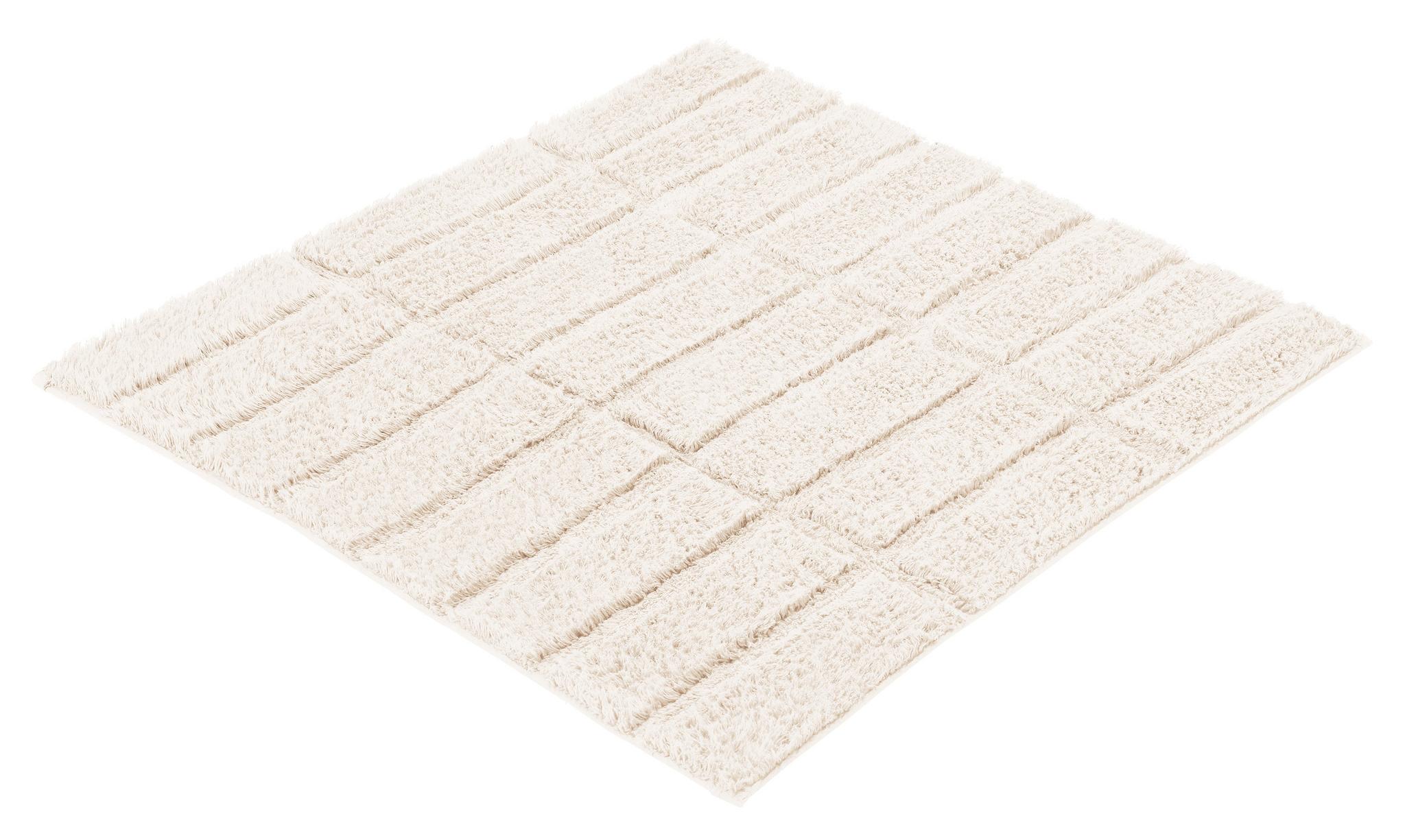 Quadratische, cremefarbene Badematte mit flauschigen Streifenstruktur