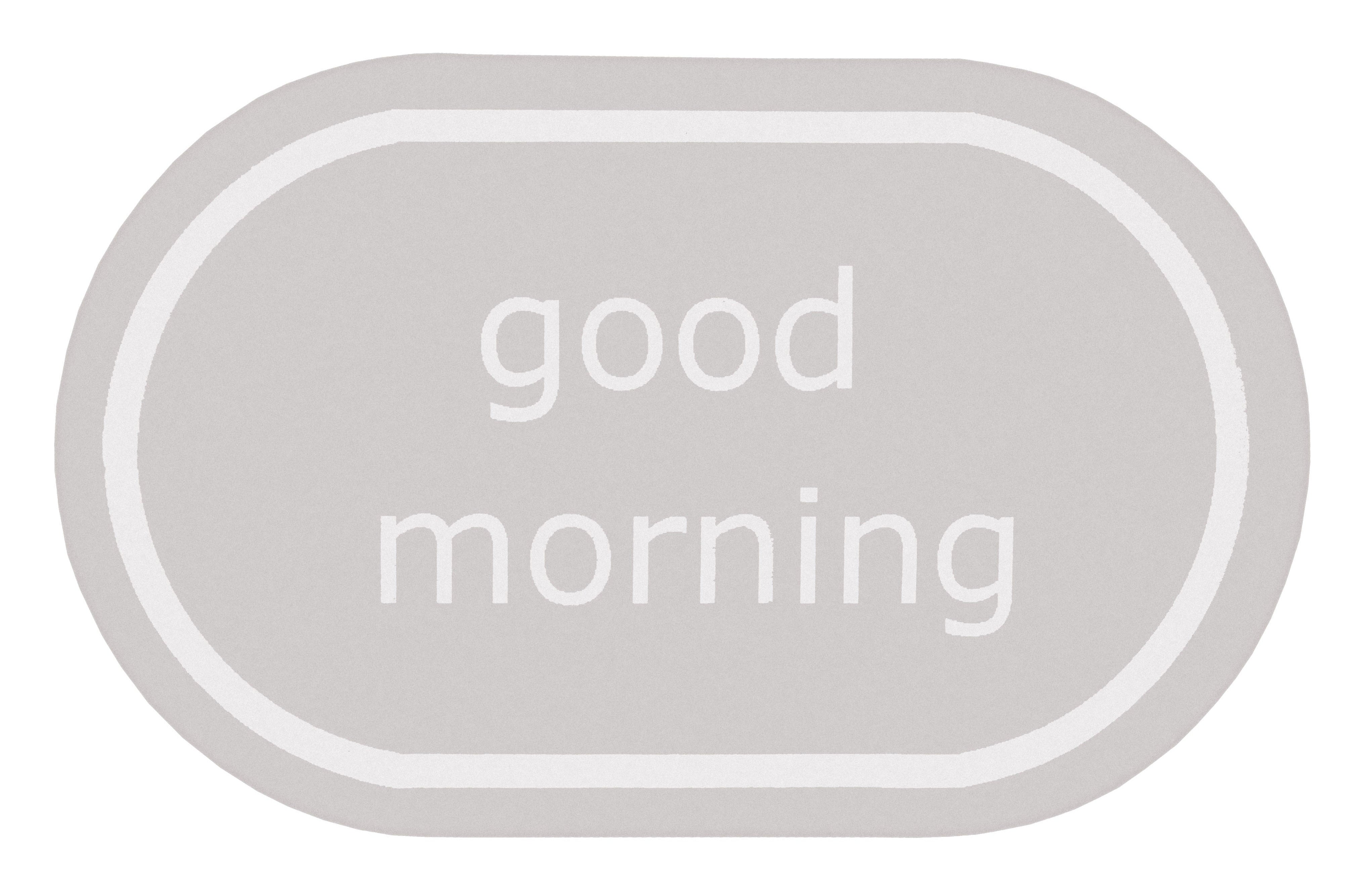 Ovaler hellgrauer Badteppich mit weißem Schriftzug good morning