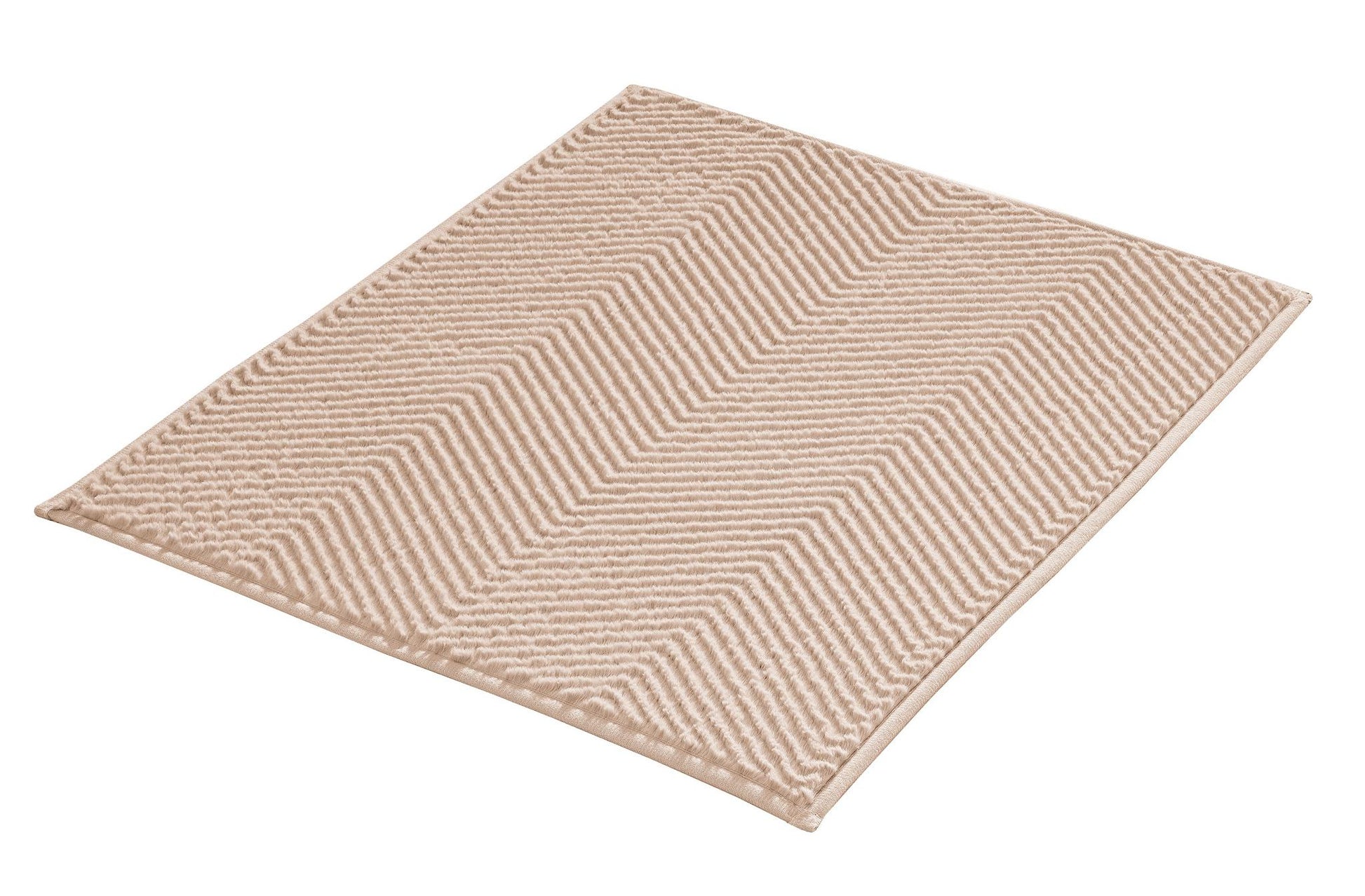 Beige Badematte mit weichem Zickzack-Muster auf rechteckiger Fläche