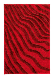 Roter Badteppich mit dunkelrotem, wellenförmigem Strukturmuster aus Stoff