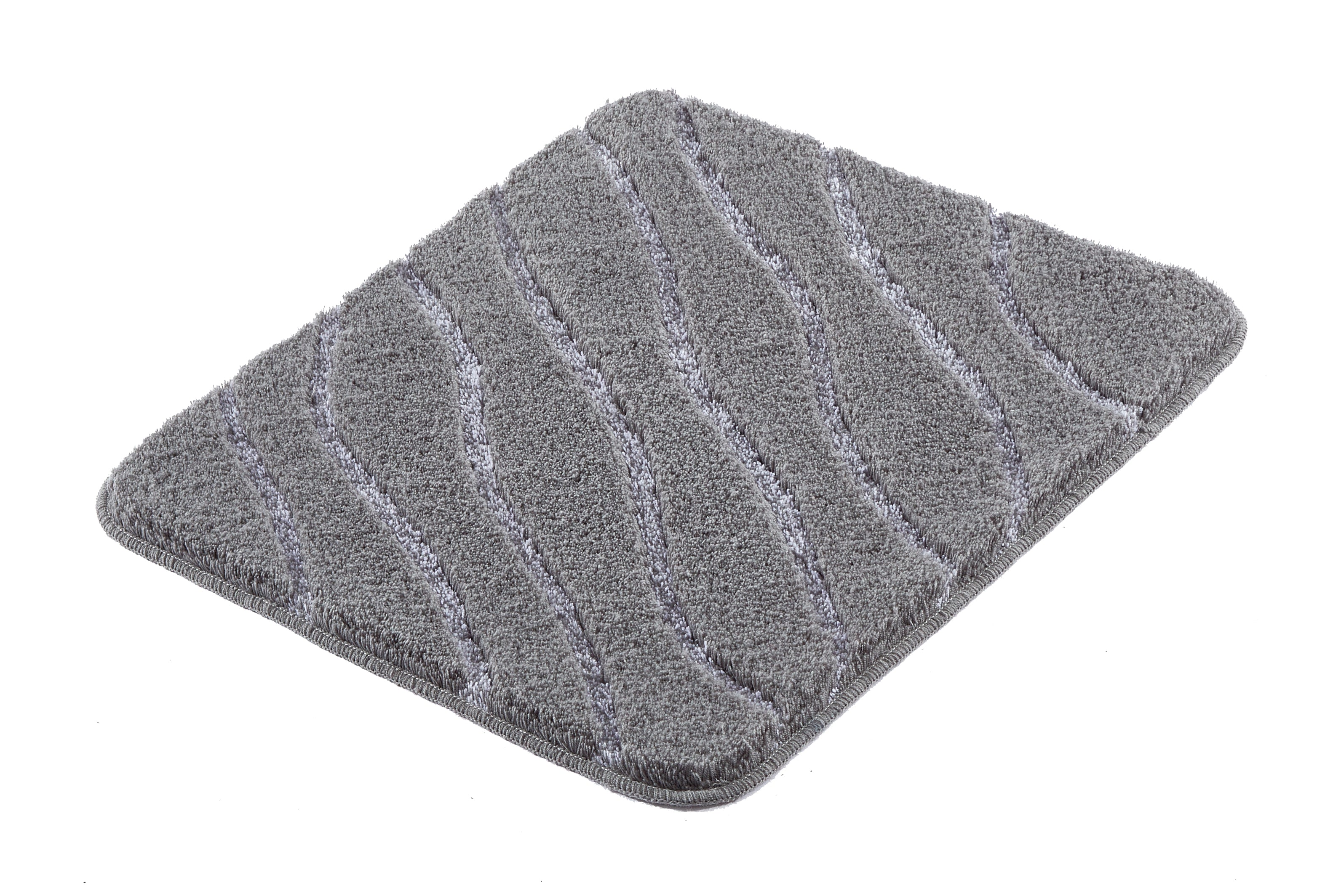 Badteppich TRAM in Anthrazit 55 x 65 cm mit wellenförmiger Struktur liegt auf weißem Untergrund.