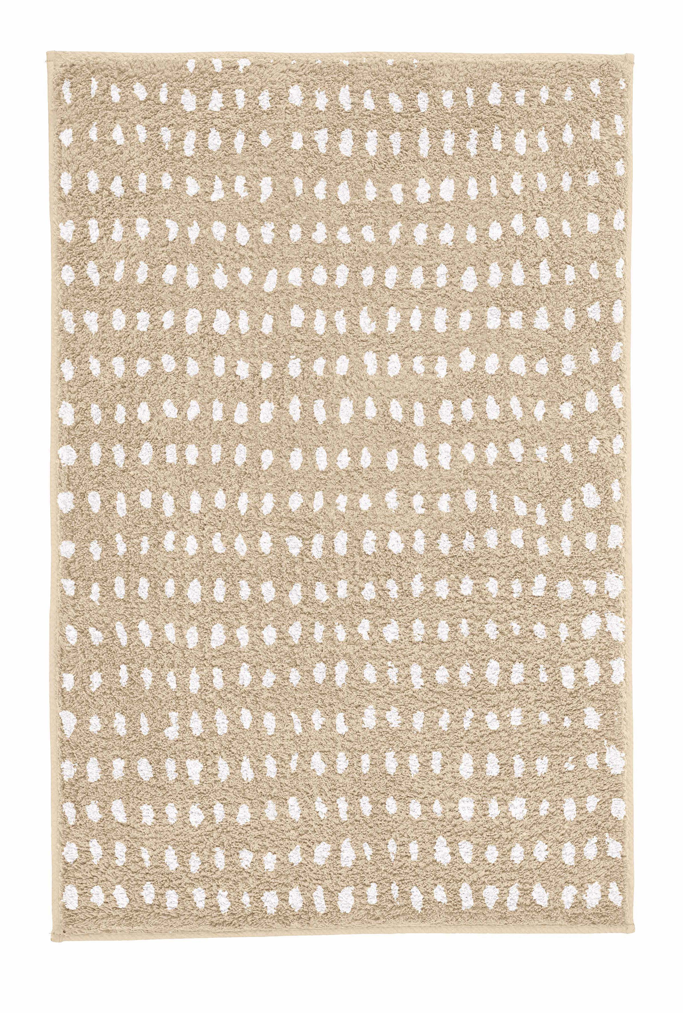 Badteppich DOTTINO Macadamia 60 x 90 cm mit weißem Punktmuster in Draufsicht.