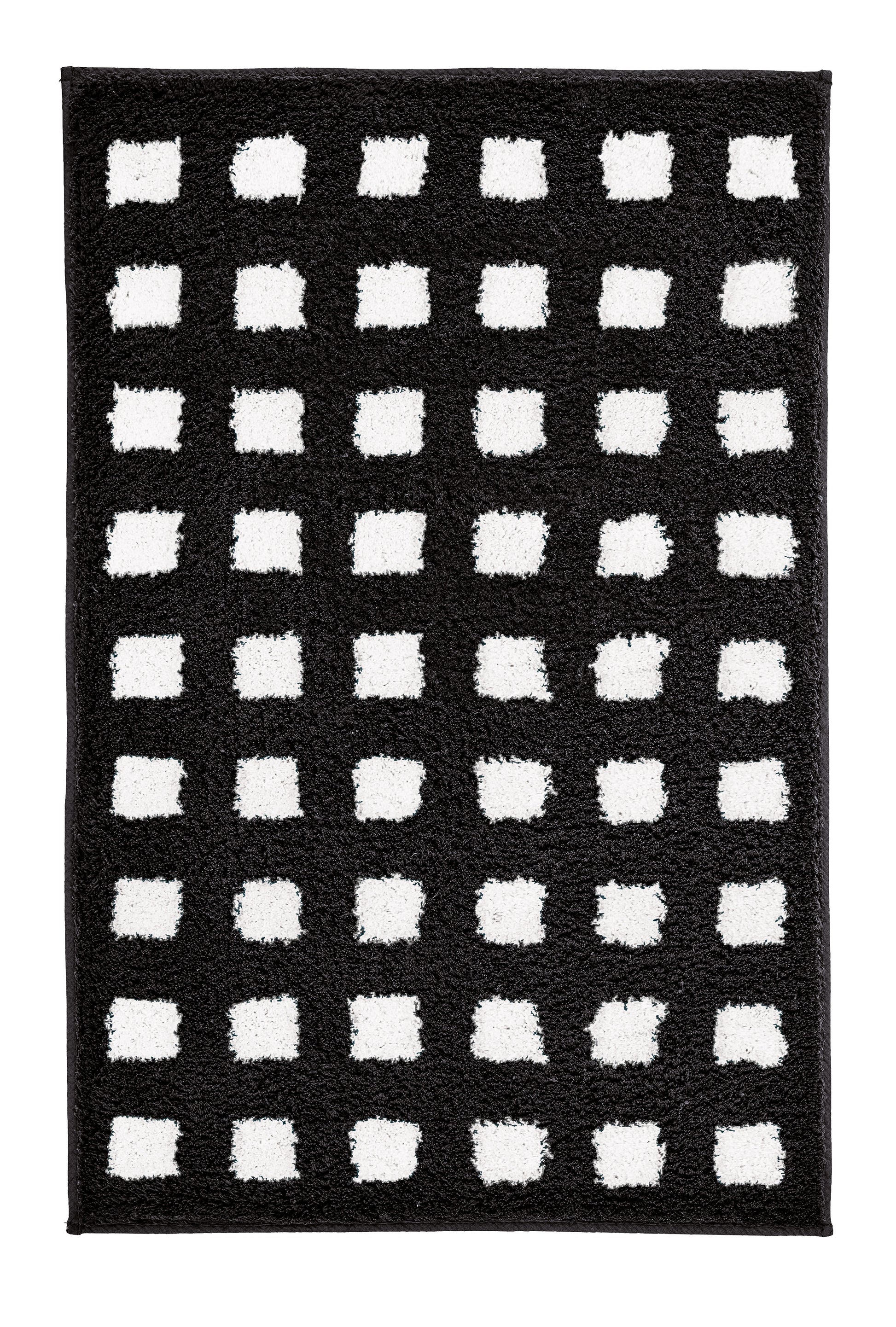 Schwarz-weißer Badteppich BOXES 60 x 90 cm mit rechteckigem Kästchenmuster liegt auf dem Boden.