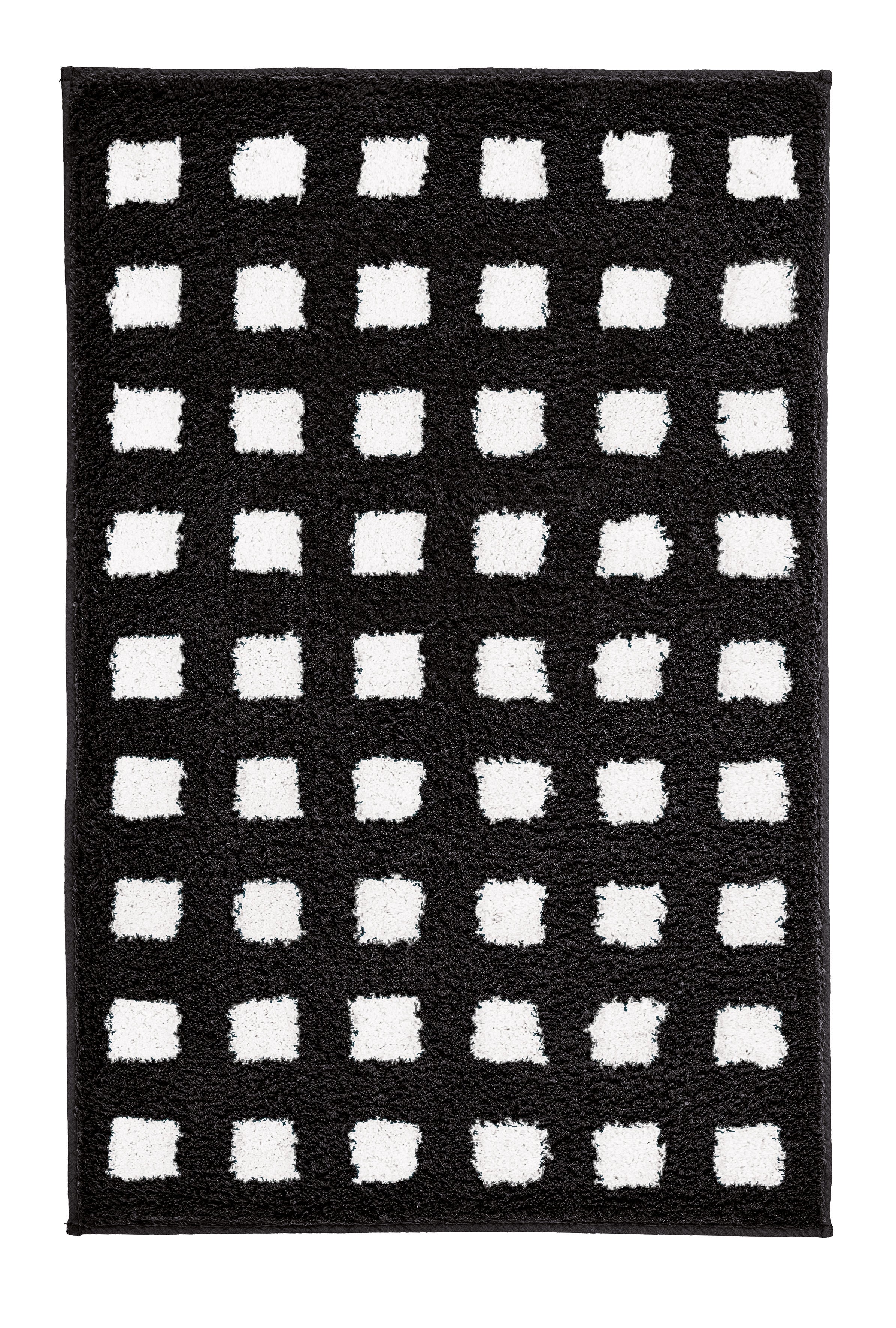 Schwarz-weißer Badteppich BOXES 60 x 90 cm mit rechteckigem Kästchenmuster liegt auf dem Boden.