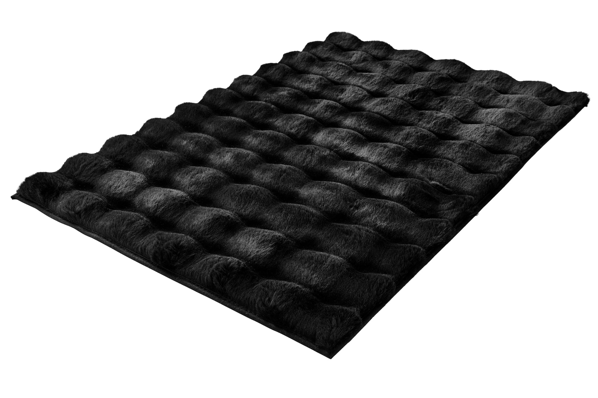 Badteppich CLOUD in Schwarz 60 x 90 cm liegt mit weich strukturierter Oberfläche auf dem Boden.