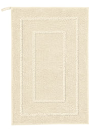 Badteppich NICO Sandbeige 50x80 cm liegt flach und zeigt seinen rechteckigen Hoch-Tief-Rahmen.