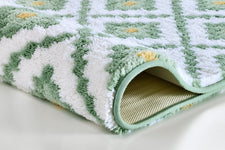 Grün-weißer Badteppich mit Muster und rutschfester Unterseite aus Textil
