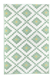 Badteppich mit grünem Rautenmuster und gelben Punkten auf Weiß