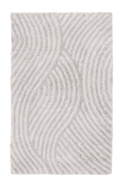 Badteppich CALMA Nebel 70 x 120 cm mit wellenförmigem Hoch-Tief-Muster in Hellgrau von oben gesehen.