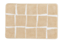 Rechteckige beigefarbene Badematte mit weißem, unregelmäßigem Karomuster