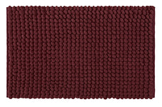 Bordeauxrote Badematte mit dichter, strukturierter Noppenoberfläche