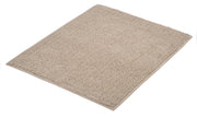 Badteppich CHRISSY Natur 55 x 65 cm liegt flach auf einem hellen Untergrund.