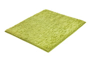 Badteppich CHRISSY Palme 55 x 65 cm in hellgrün liegt flach auf weißem Hintergrund.