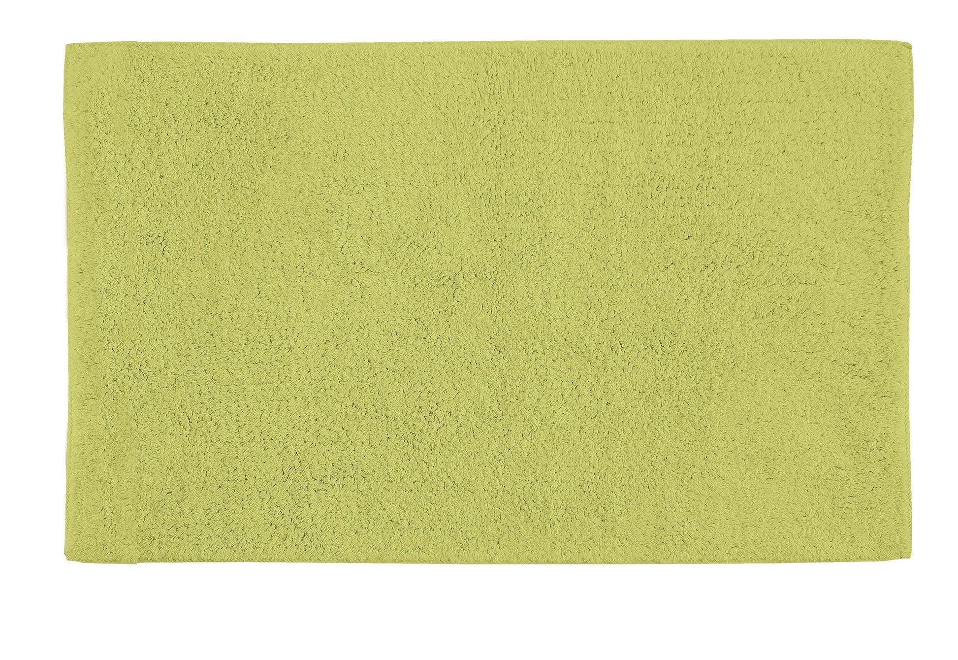 Badteppich CHRISSY Palme 60x100 cm in Palmen-Grün liegt flach ausgebreitet.