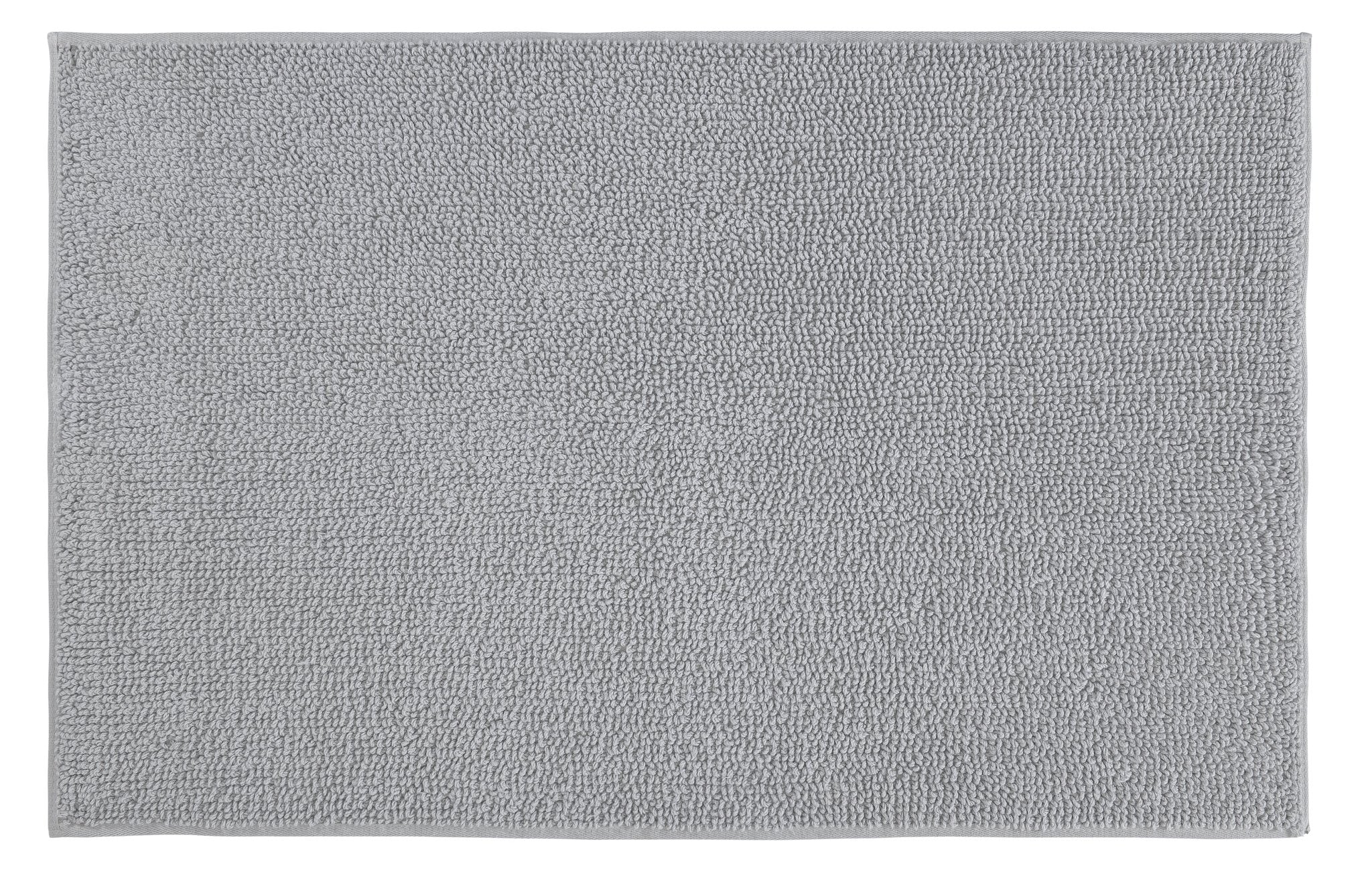 Badteppich CHRISSY in Silbergrau 60 x 100 cm liegt rechteckig mit dichter Struktur auf dem Boden.