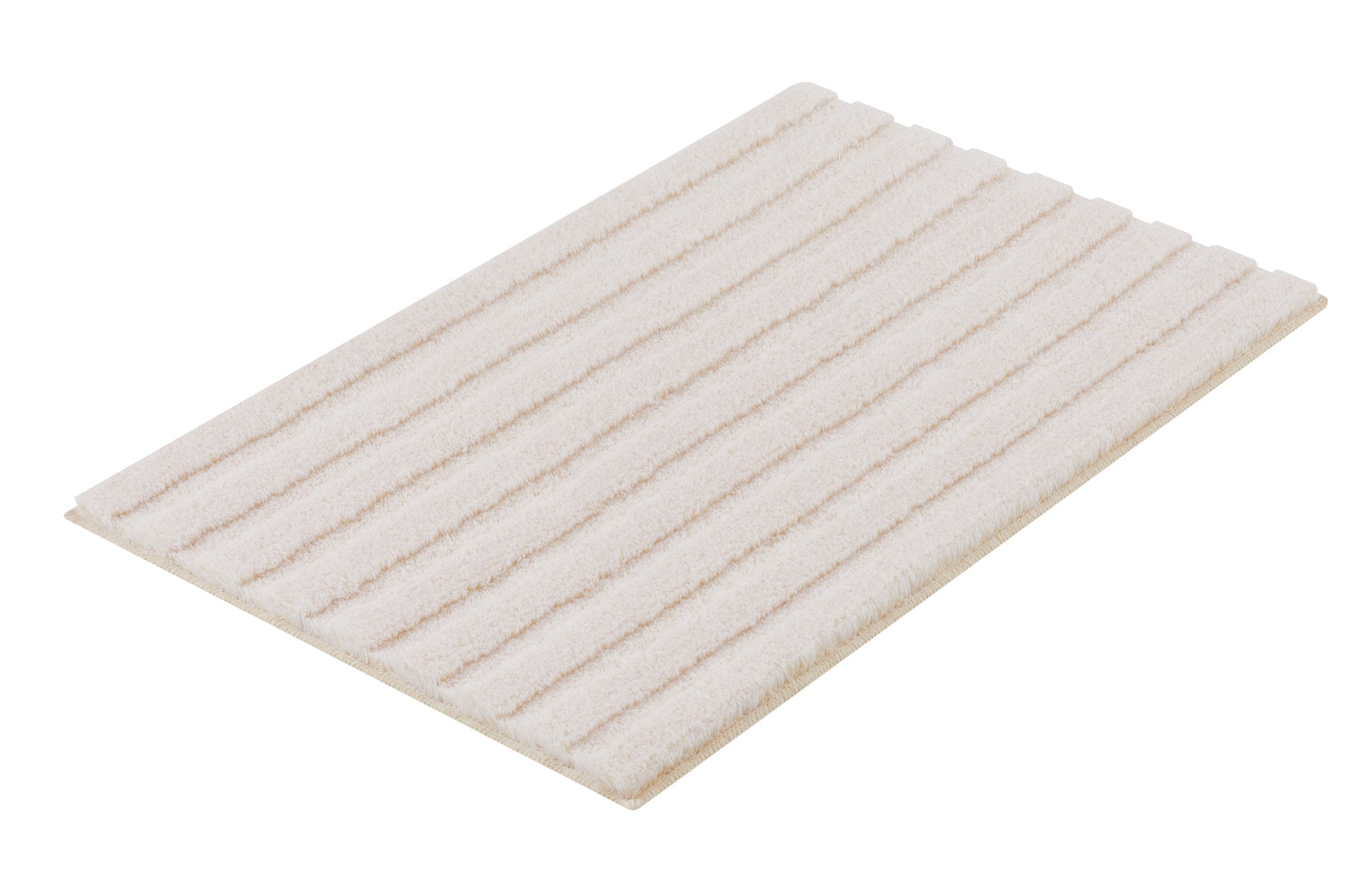 Rechteckige, cremefarbene Badematte mit längs verlaufender Rippenstruktur