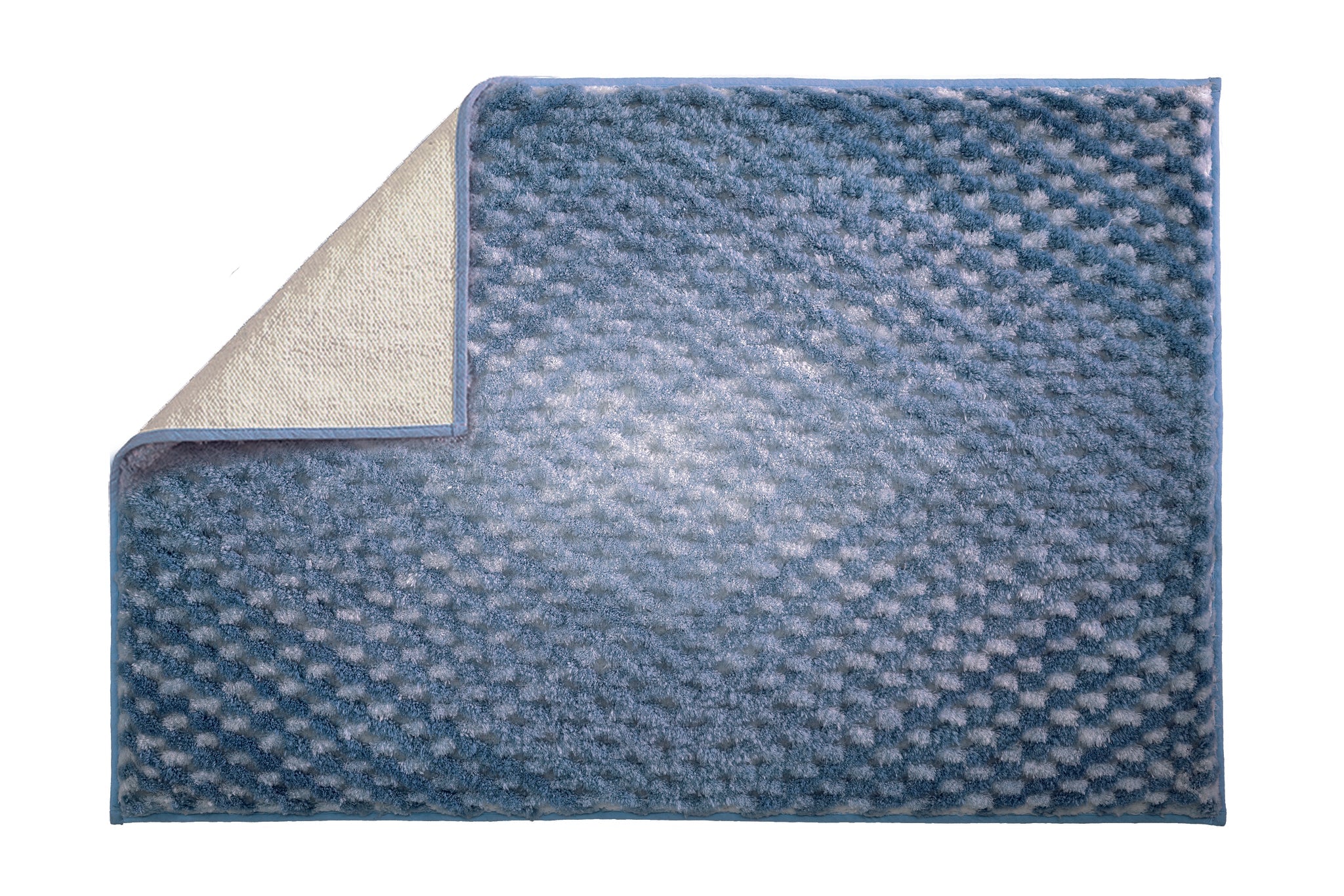 Blaue Badematte mit Waffelstruktur, umgeklappte Ecke zeigt Unterseite