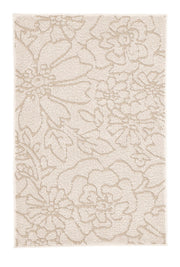 Cremefarbiger Badteppich mit floralem Reliefmuster.