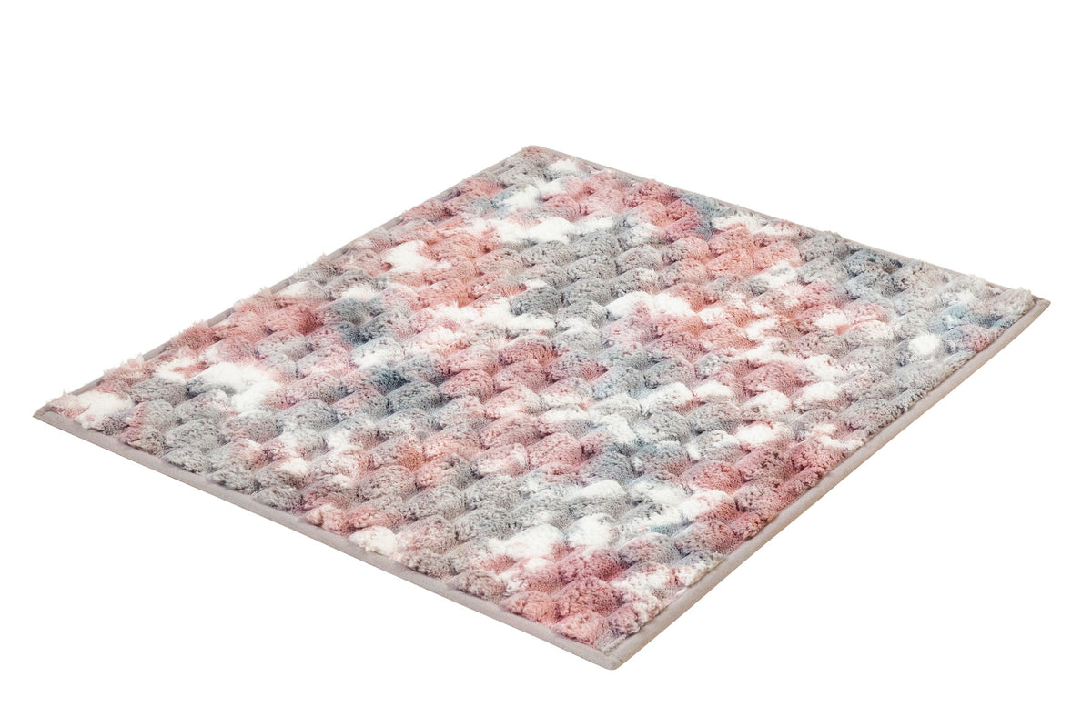 Flauschiger Teppich in Rosa, Grau und Weiß mit strukturierter Oberfläche.