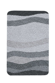 Badteppich MIAMI Schiefer 65 x 115 cm mit grauen Wellenmustern von oben gesehen.