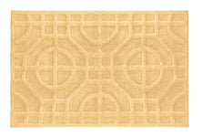 Gelbe Badematte mit eingewebtem, geometrischem Kreis- und Linienmuster