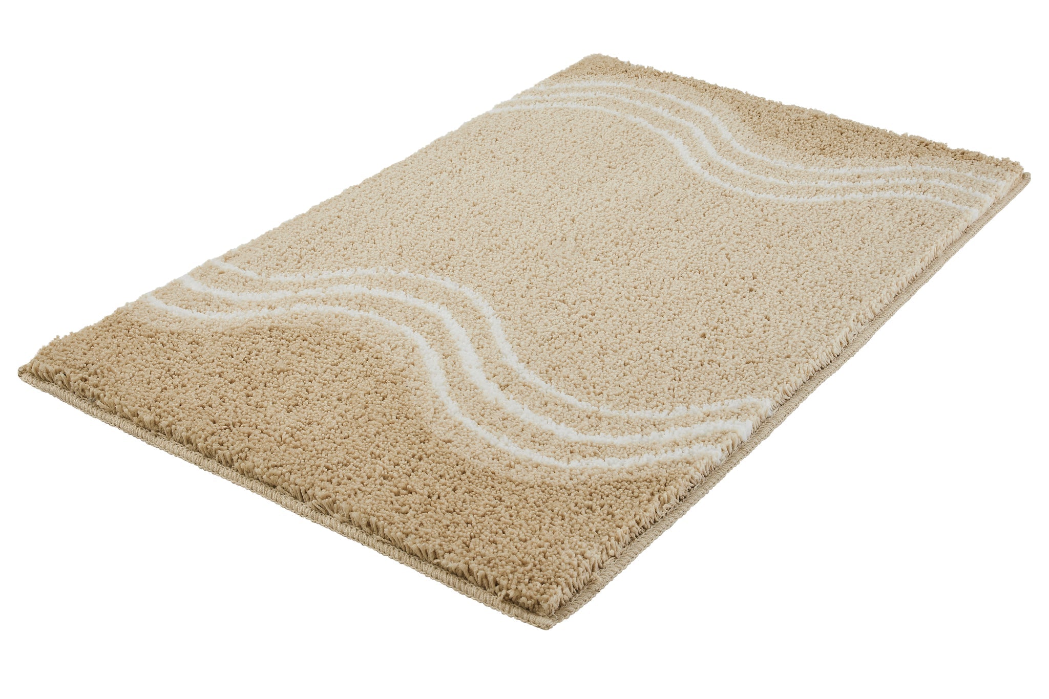 Badteppich MOVE sandbeige 65 x 115 cm liegt mit Wellenmuster auf dem Boden.
