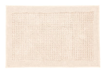 Rechteckige beige Badematte mit strukturierter Fläche in der Mitte