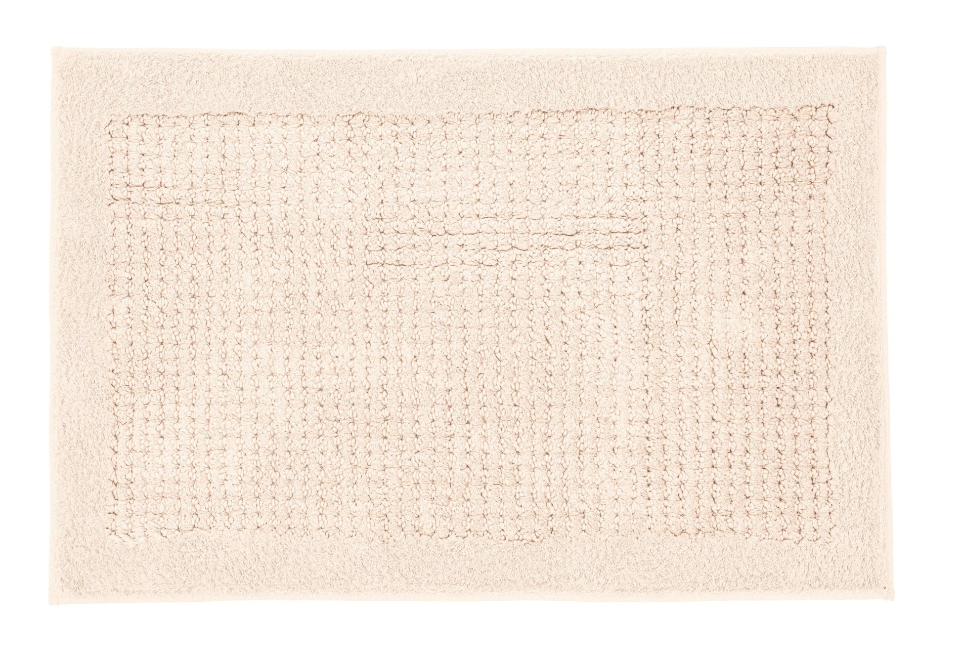 Auf dem Bild liegt ein rechteckiger Badteppich NET Natur 60 x 90 cm.