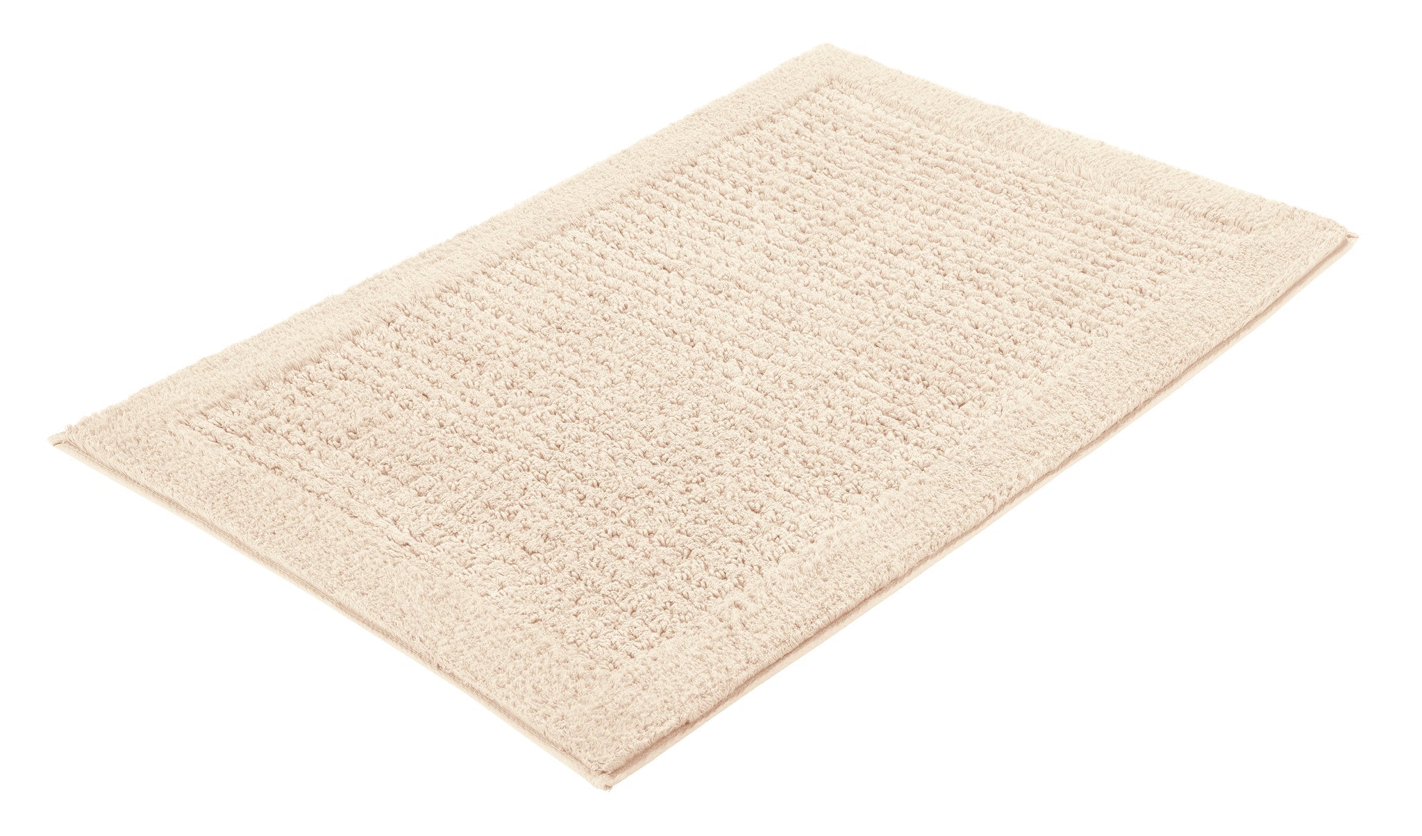 Badteppich NET Natur 70 x 120 cm liegt flach auf hellem Untergrund.