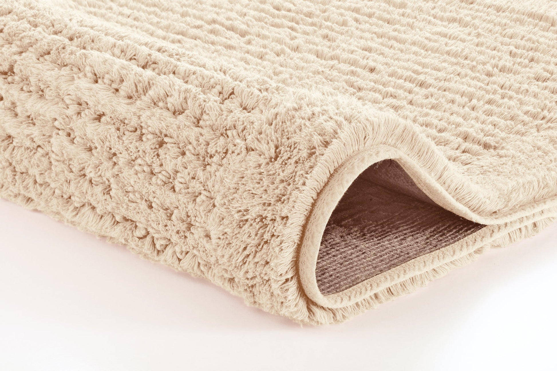 Badteppich NET Natur 70 x 120 cm als Detailansicht der weichen, strukturierten Oberfläche.